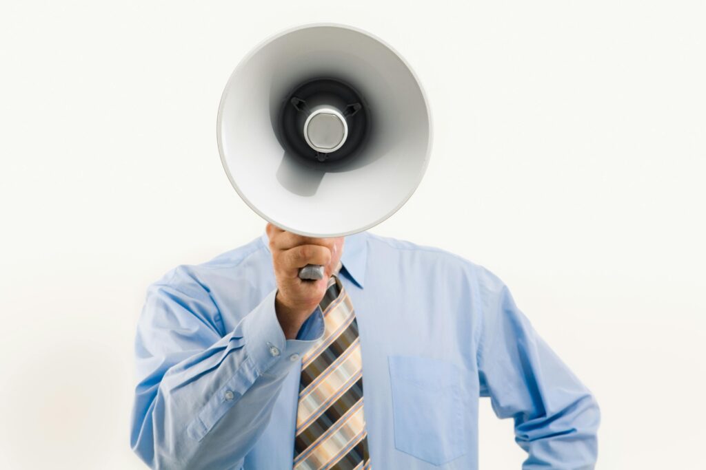 Man with megaphone representing an artificial voice box